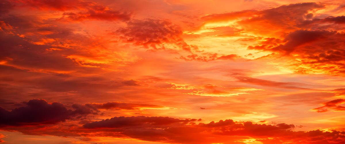 Sunset ultrawide wallpaper -- orange and red sunset cloud filling the frame, free 3440x1440 download